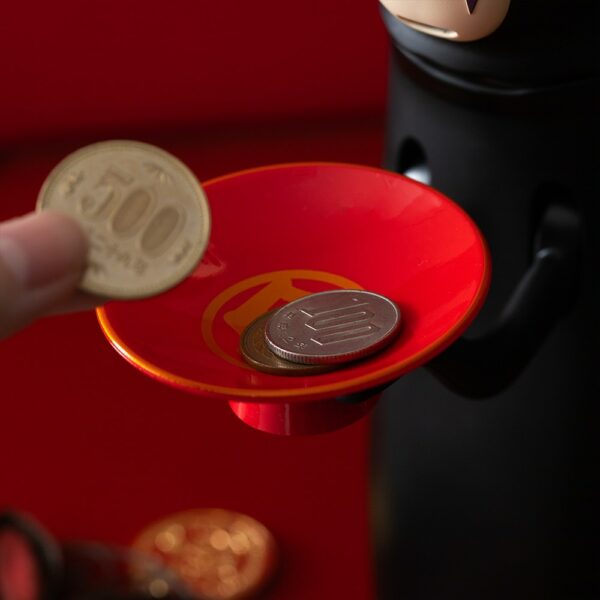 The Spirited Away No Face Munching Piggy Bank